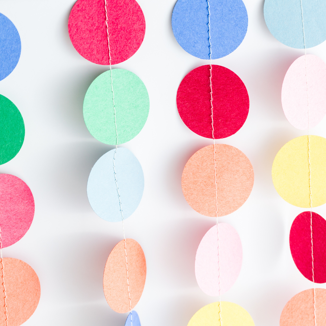 colorful paper circles hanging on strings