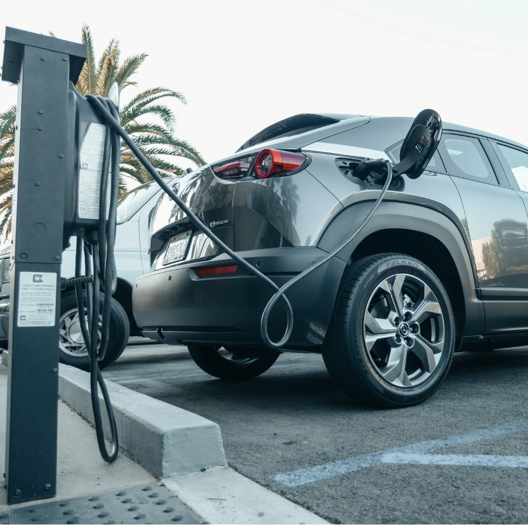 electric vehicle plugged into charging station