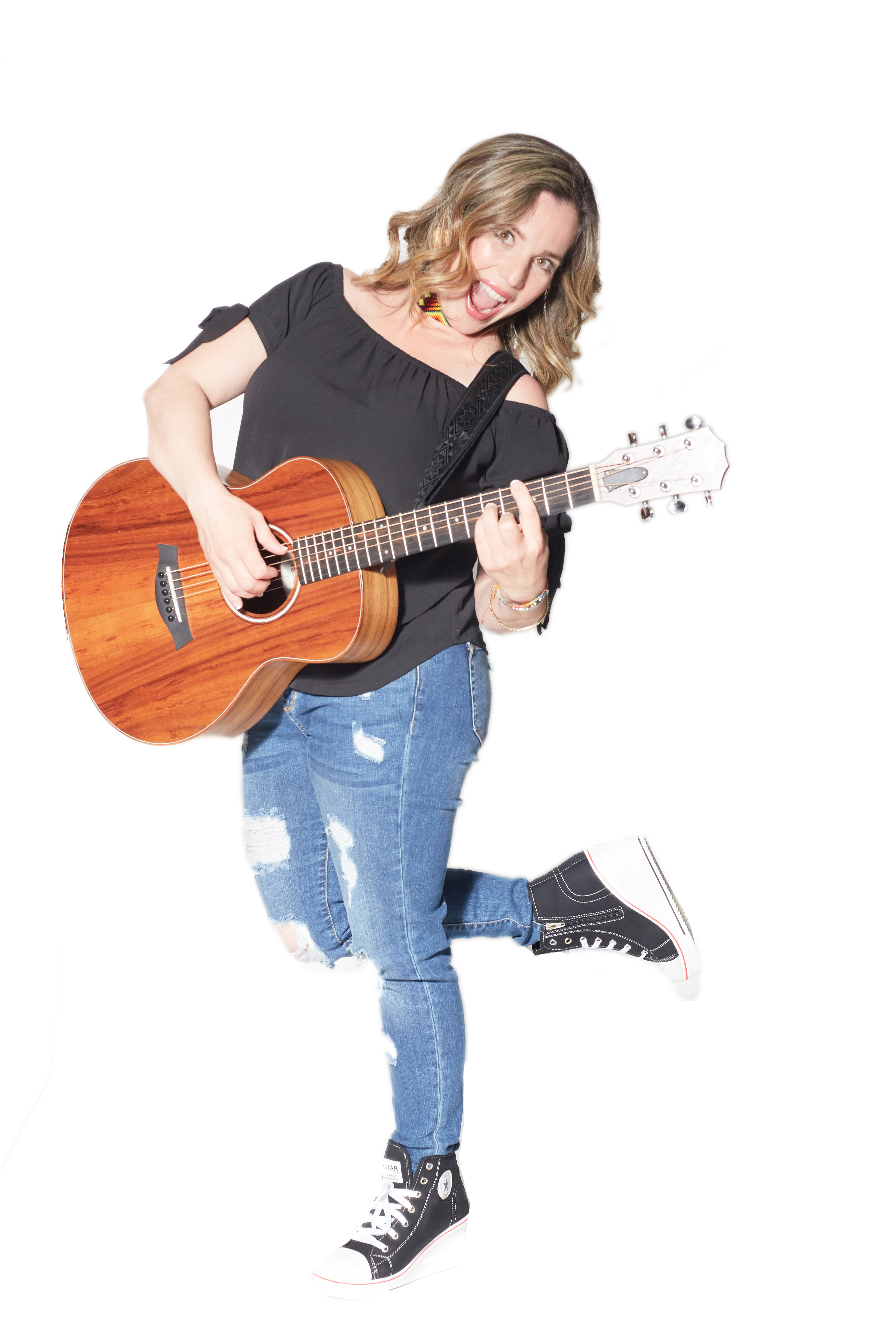 Nathalia holding an acoustic guitar against a white background