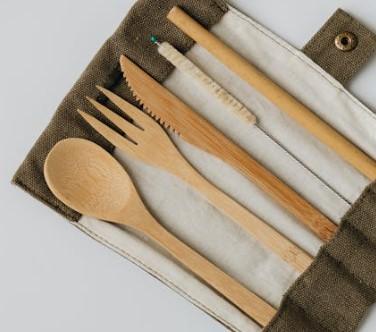 Bamboo cutlery laid out on fabric