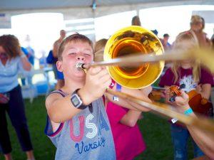 A child playing a trombone