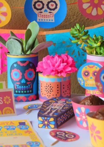 Flower vases decorated with sugar skull designs.