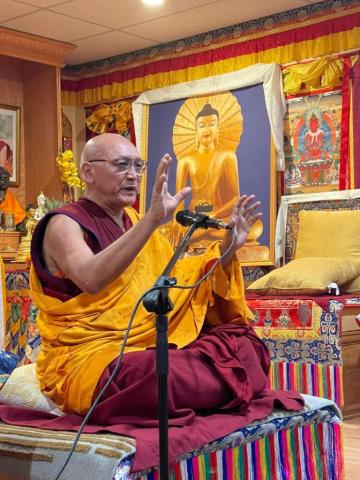 Image of a seated Tibetan monk