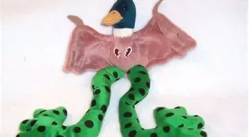 stuffed animal with duck head, bat wings, and frog legs