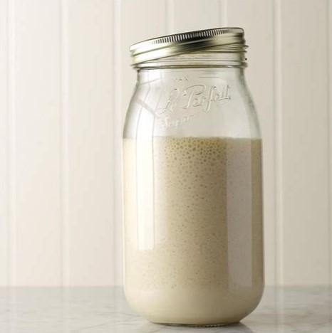 Mason jar filled with sourdough starter